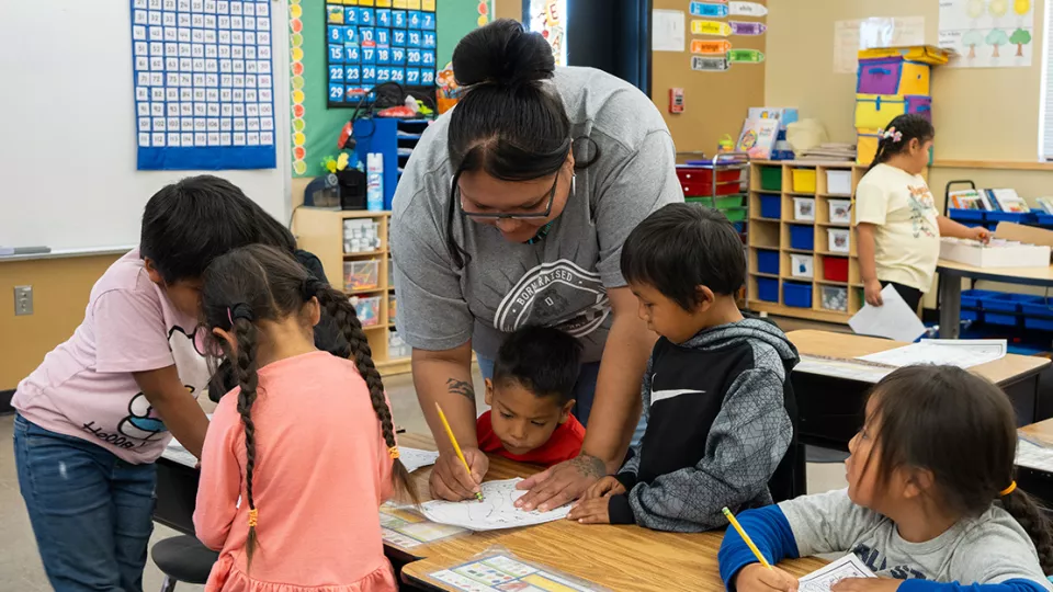 Teacher showing an assignment